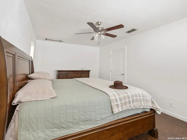 a bedroom with a bed and window