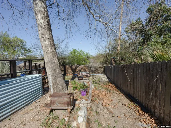 a view of a backyard with sitting area