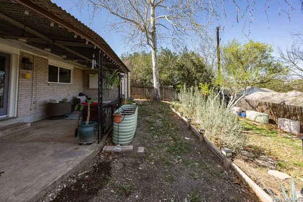 a view of backyard with green space