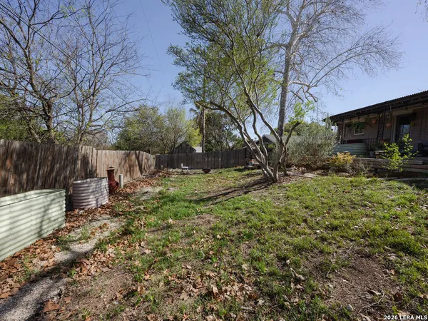 a view of a backyard with sitting area