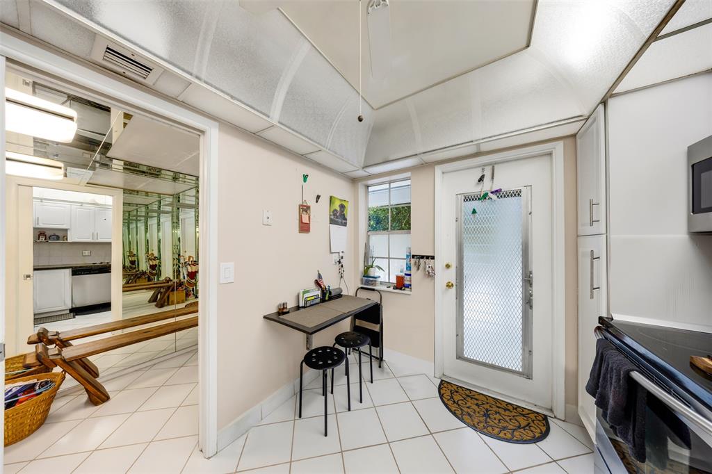 3150 North Course Lane, Unit 203 Pompano Beach, FL 33069 - Photo 4 of 26 a living room with furniture and a fireplace