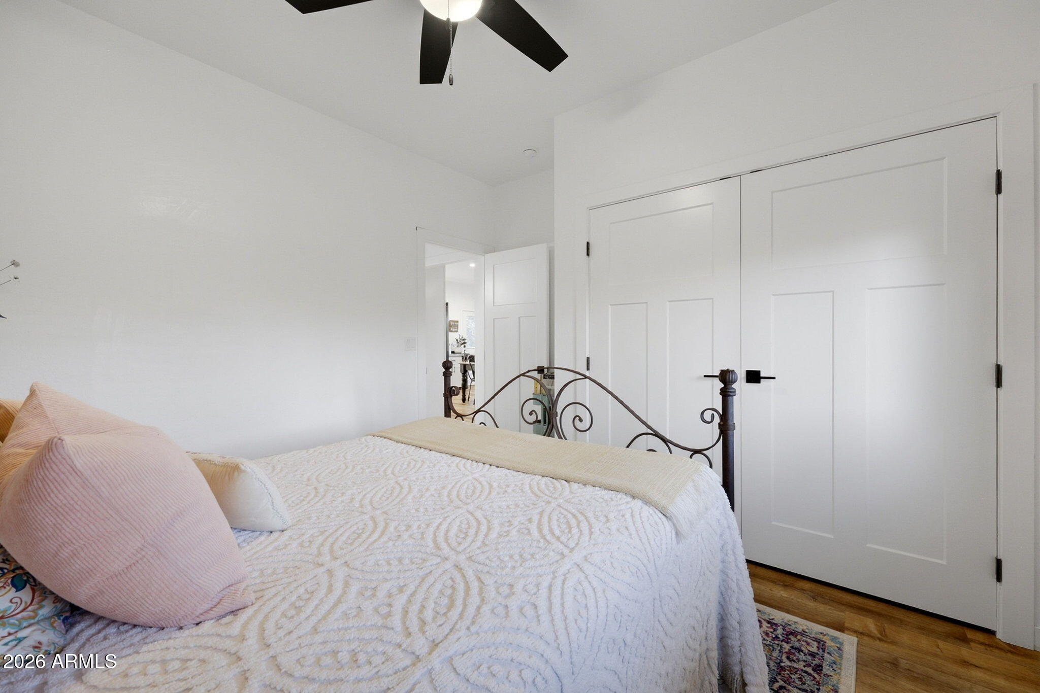 2225 Roundabout Way Overgaard, AZ 85933 - Photo 14 of 32 a bedroom with a bed and a ceiling fan
