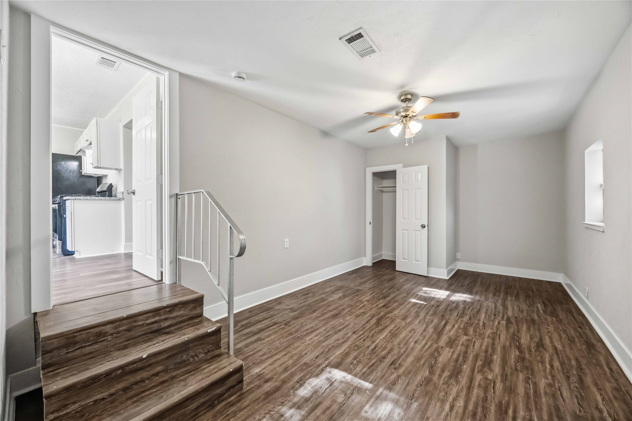 113 East Witcher Lane Houston, TX 77076 - Photo 14 of 21 wooden floor in an empty room with a mirror