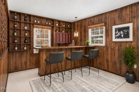 a view of a dining room with furniture and window