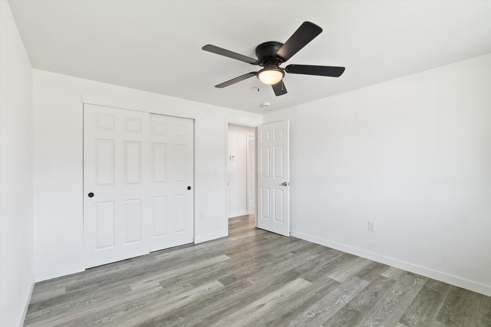 3276 School Street Redding, CA 96002 - Photo 14 of 36 a view of a big room with wooden floor and windows in a room