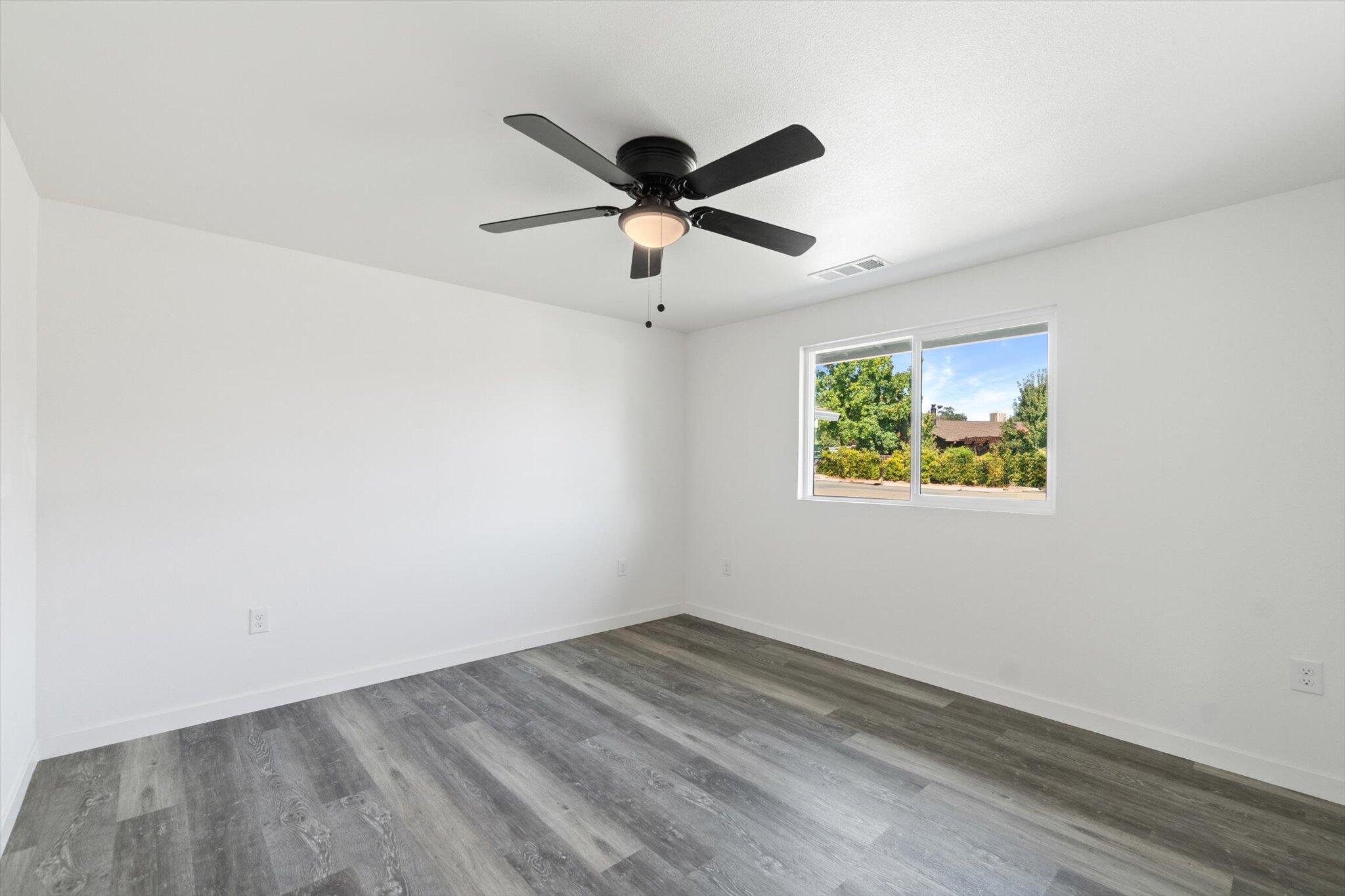 3276 School Street Redding, CA 96002 - Photo 15 of 36 a view of empty room with wooden floor