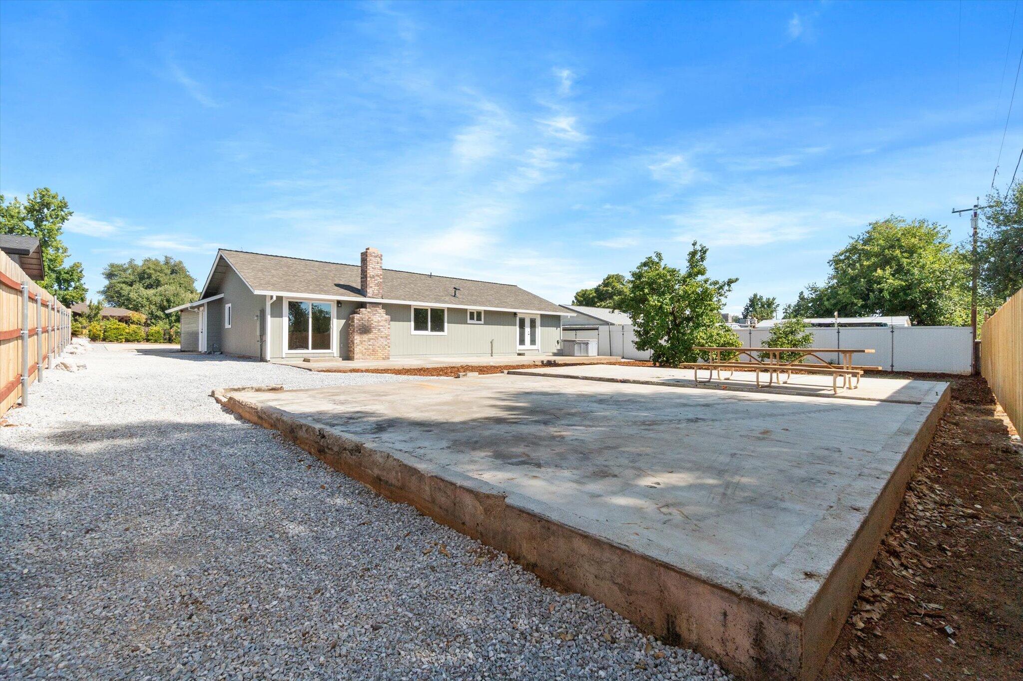 3276 School Street Redding, CA 96002 - Photo 20 of 36 a view of a house with a yard