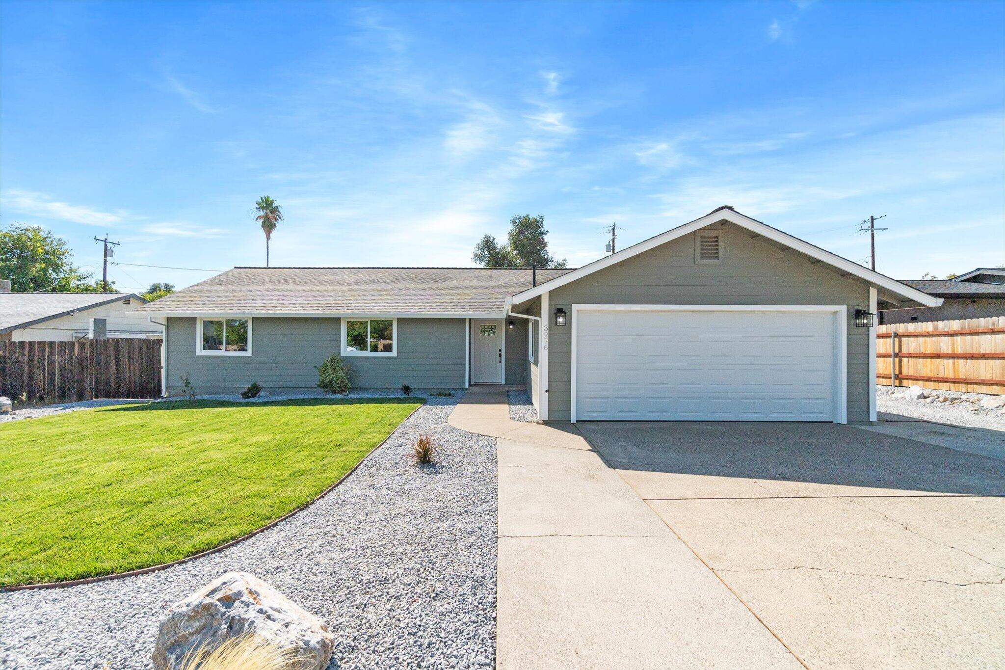 3276 School Street Redding, CA 96002 - Photo 27 of 36 a front view of a house with garden