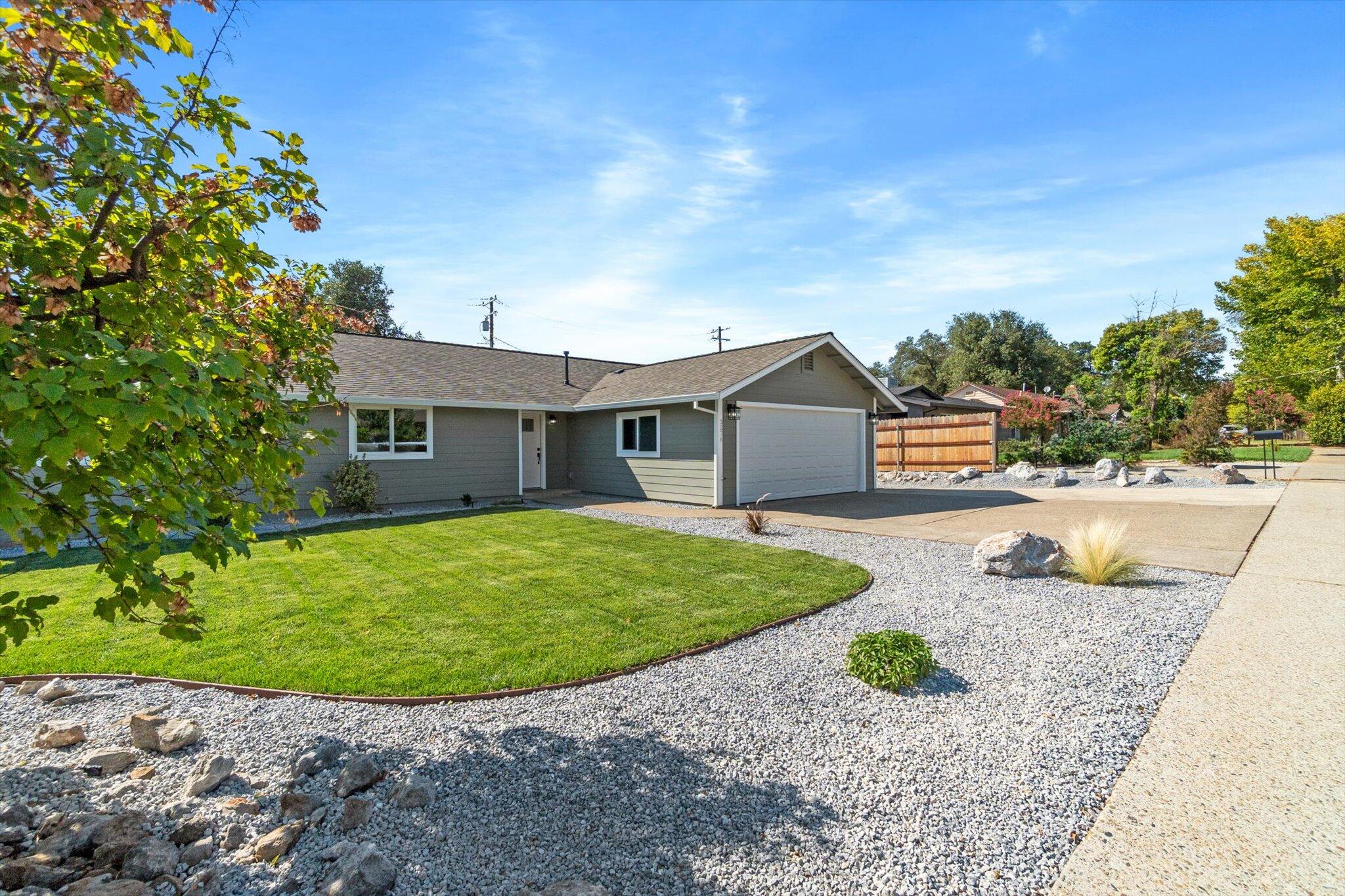 3276 School Street Redding, CA 96002 - Photo 28 of 36 a view of a house with backyard and sitting area