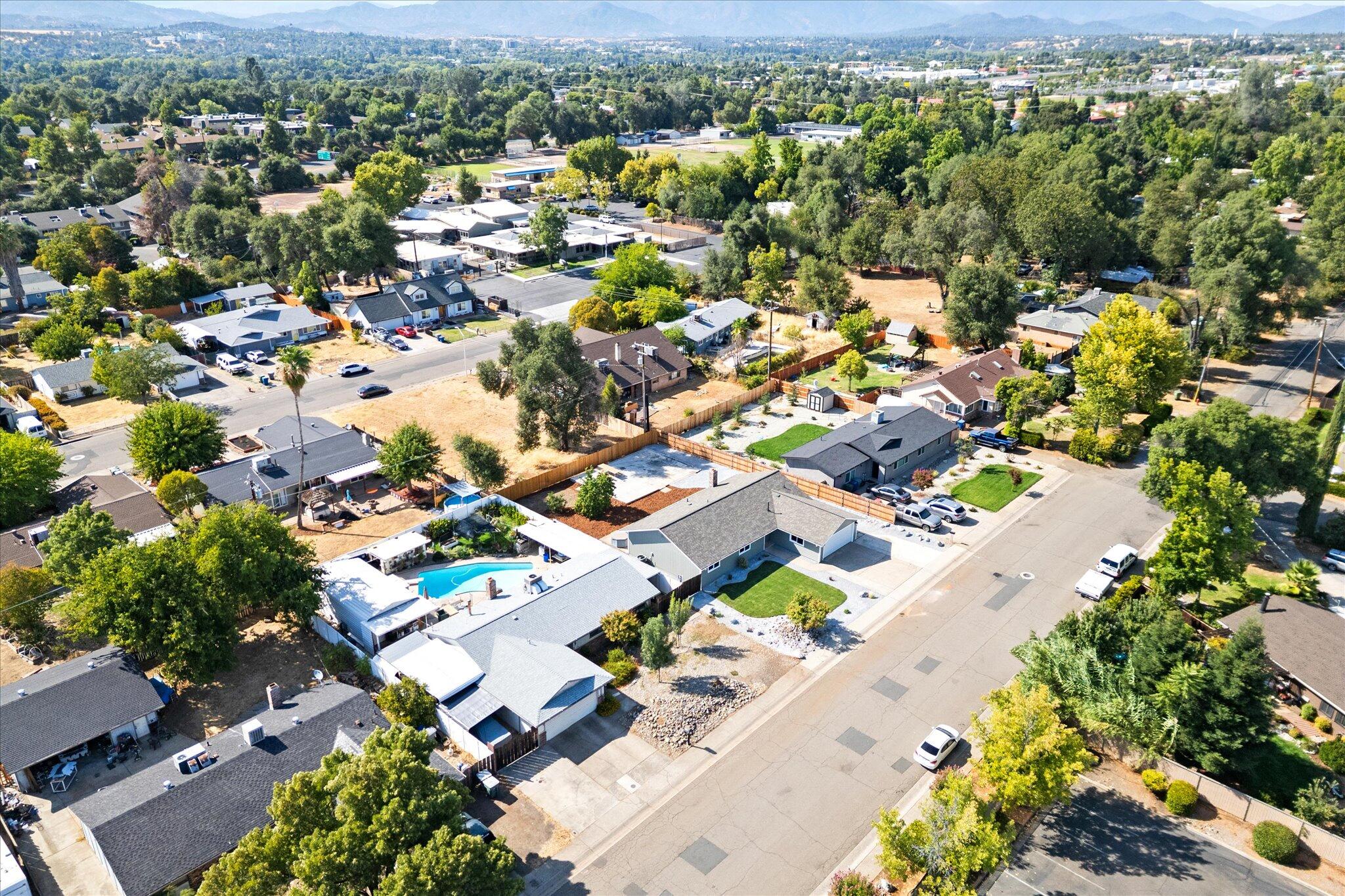 3276 School Street Redding, CA 96002 - Photo 32 of 36 an aerial view of residential houses with outdoor space