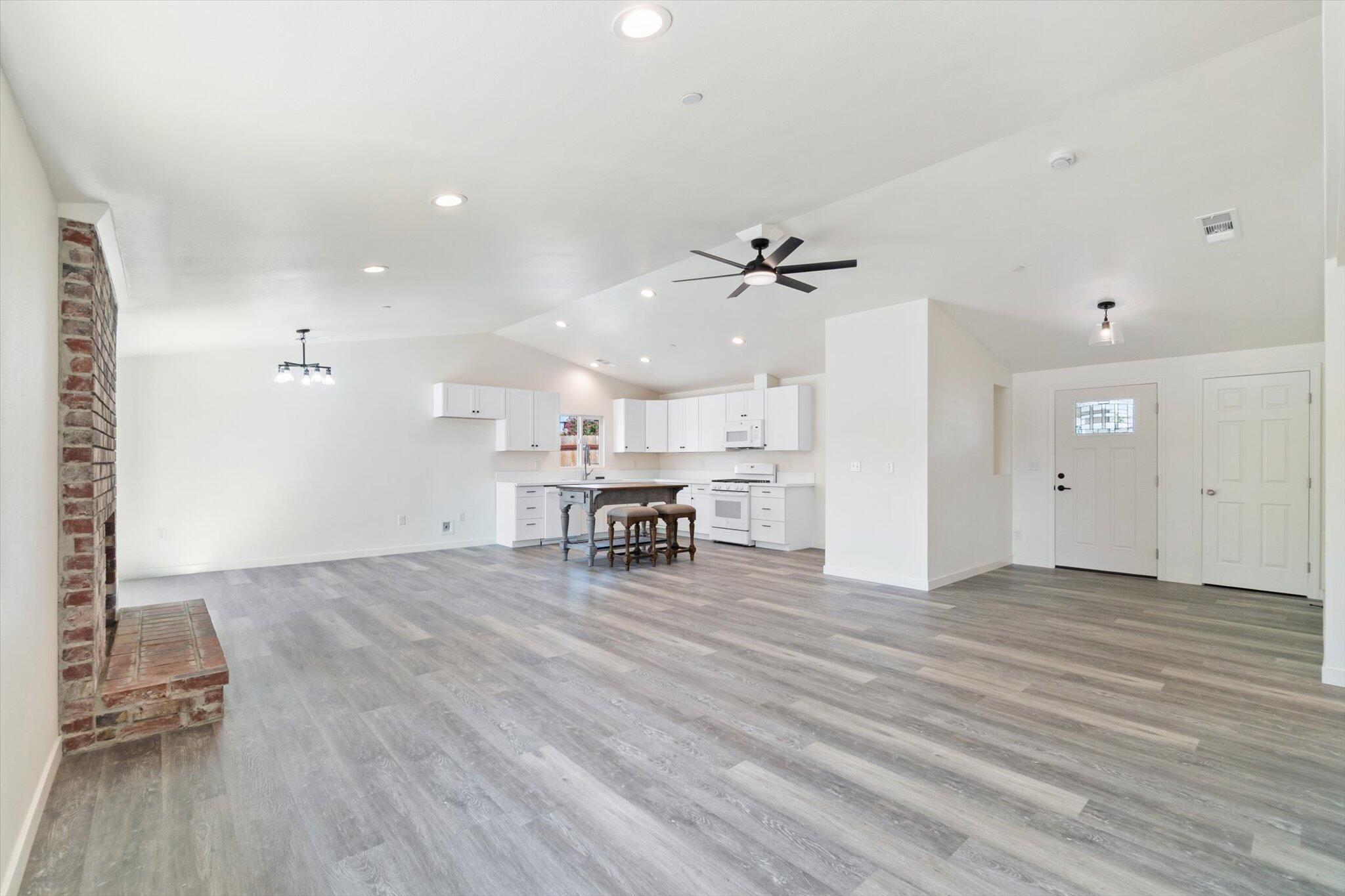 3276 School Street Redding, CA 96002 - Photo 6 of 36 a view of an empty room with a window and wooden floor