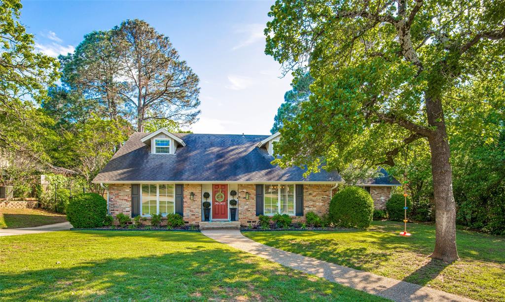 1412 Ridgecrest Circle Denton, TX 76205 - Photo 1 of 1 a view of a big house with a big yard and large trees