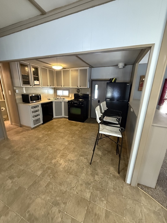 4 Center Street Brimfield, MA 01010 - Photo 10 of 16 a living room with furniture and a flat screen tv