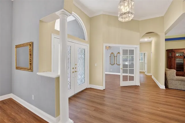 a large kitchen with kitchen island a large counter space a sink stainless steel appliances and cabinets