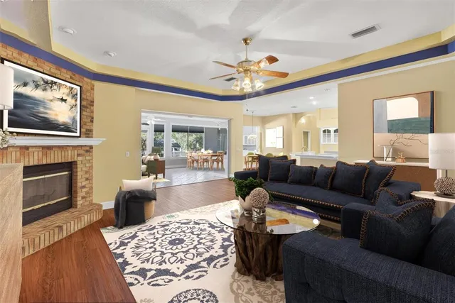 a large white kitchen with white cabinets and a refrigerator