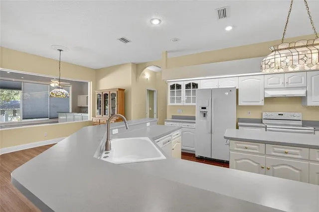 a bedroom with a bed and ceiling fan