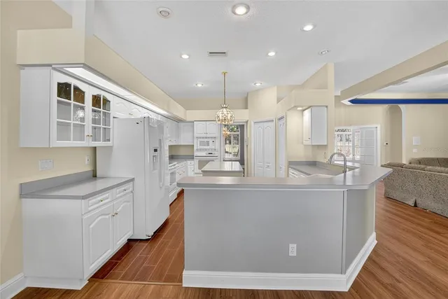 a view of a livingroom with workspace and a window