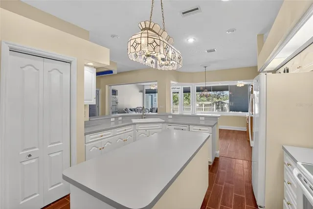 a bedroom with a bed and a potted plant