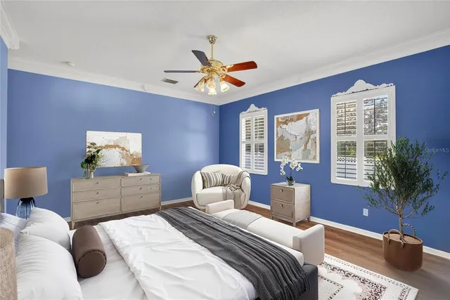 a view of a house with a yard and large tree