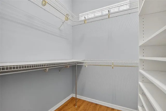 a tall yellow house with a yard