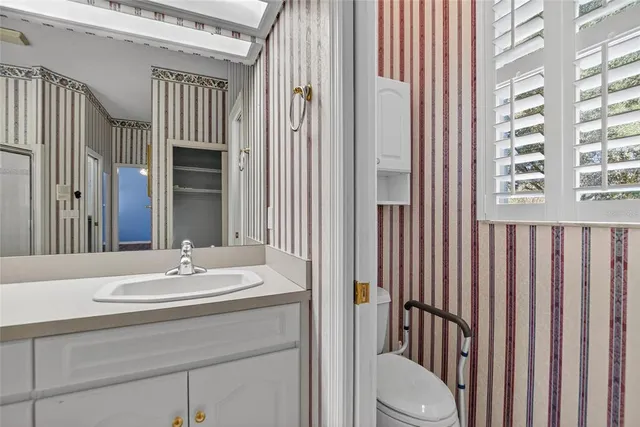 an aerial view of residential houses with outdoor space and lake view