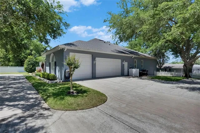 a living room with furniture a chandelier and a window
