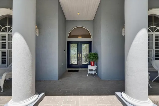a view of a dining room with furniture wooden floor and chandelier