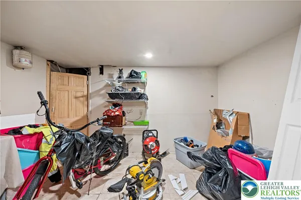 a view of a storage & utility room with two washing machine