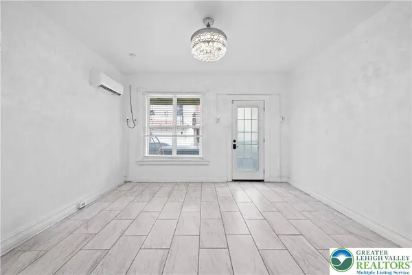a view of an empty room with a window