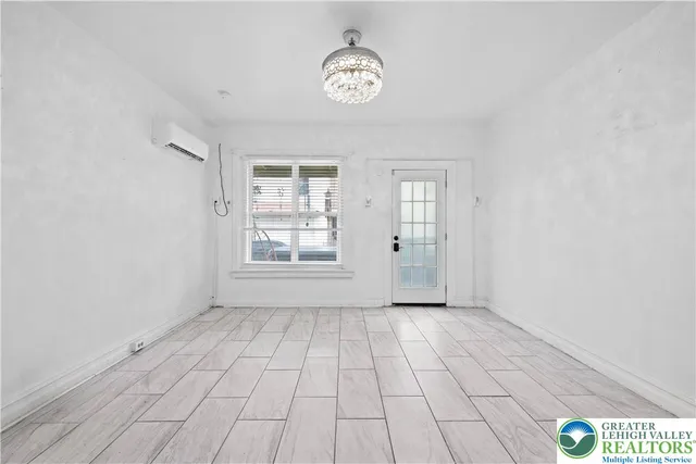 a view of a storage & utility room with two washing machine