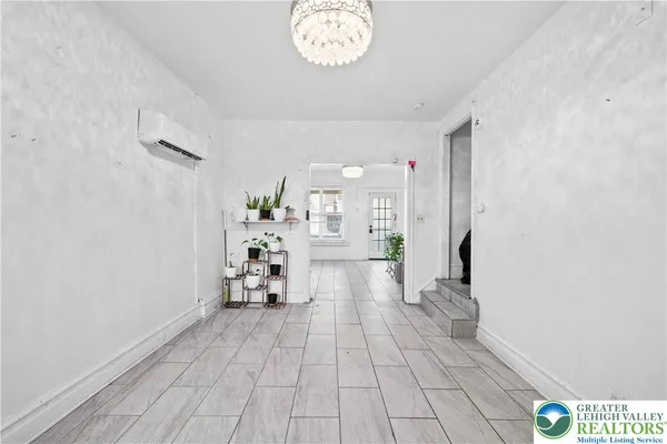 a view of a hallway with a chandelier