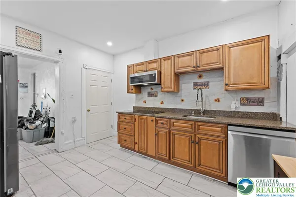 a spacious bathroom with a sink double vanity and a mirror