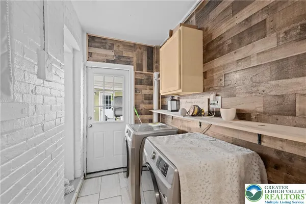 a kitchen that has a sink and a stove in it