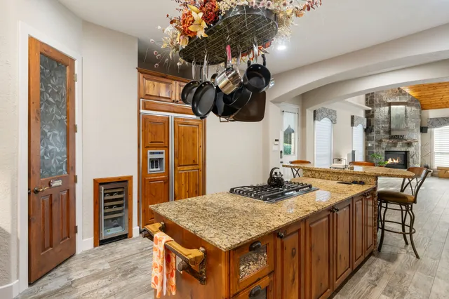 a kitchen that has a stove and a table