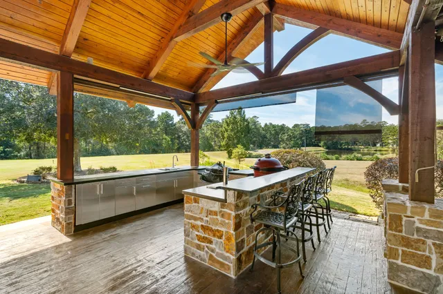 a outdoor dining space with furniture and garden view