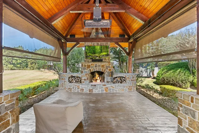 a view of a house with swimming pool and sitting area