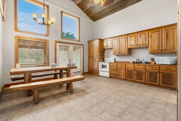 a kitchen with a stove a sink and a refrigerator