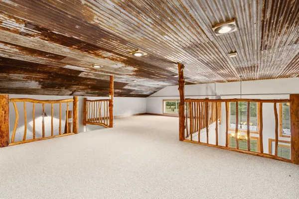 a view of water heater room with stairs