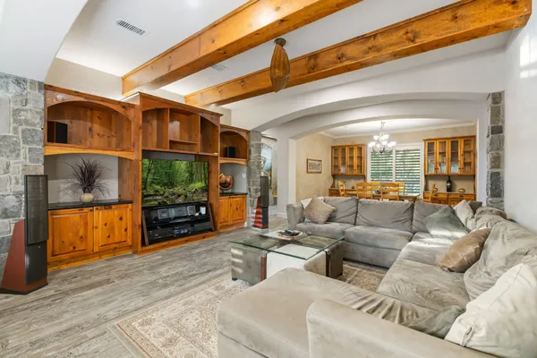 a living room with furniture and a large window