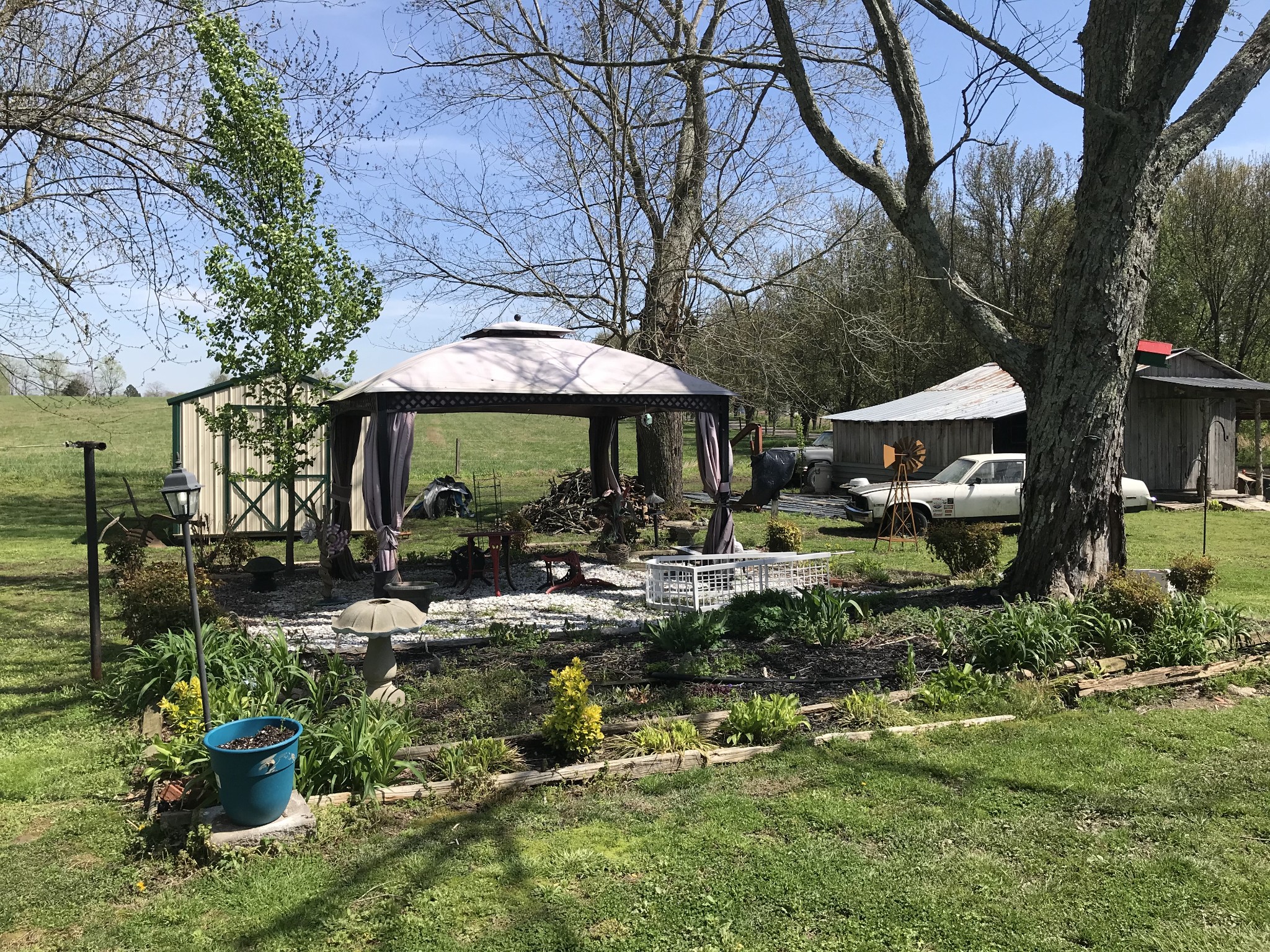 572 Rabbit Trail Road Leoma, TN 38468 - Photo 2 of 24 a view of patio with table and chairs under an umbrella