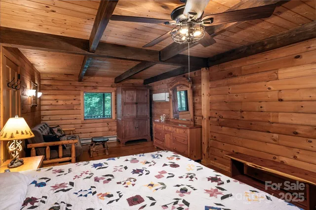 a room with a bed and a chandelier