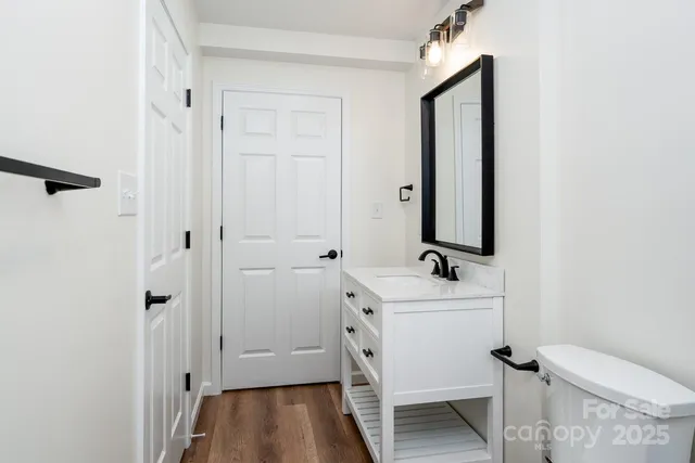 a view of livingroom with hardwood floor and hallway
