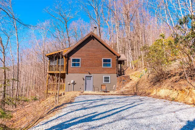 a view of a terrace with chairs and refrigerator