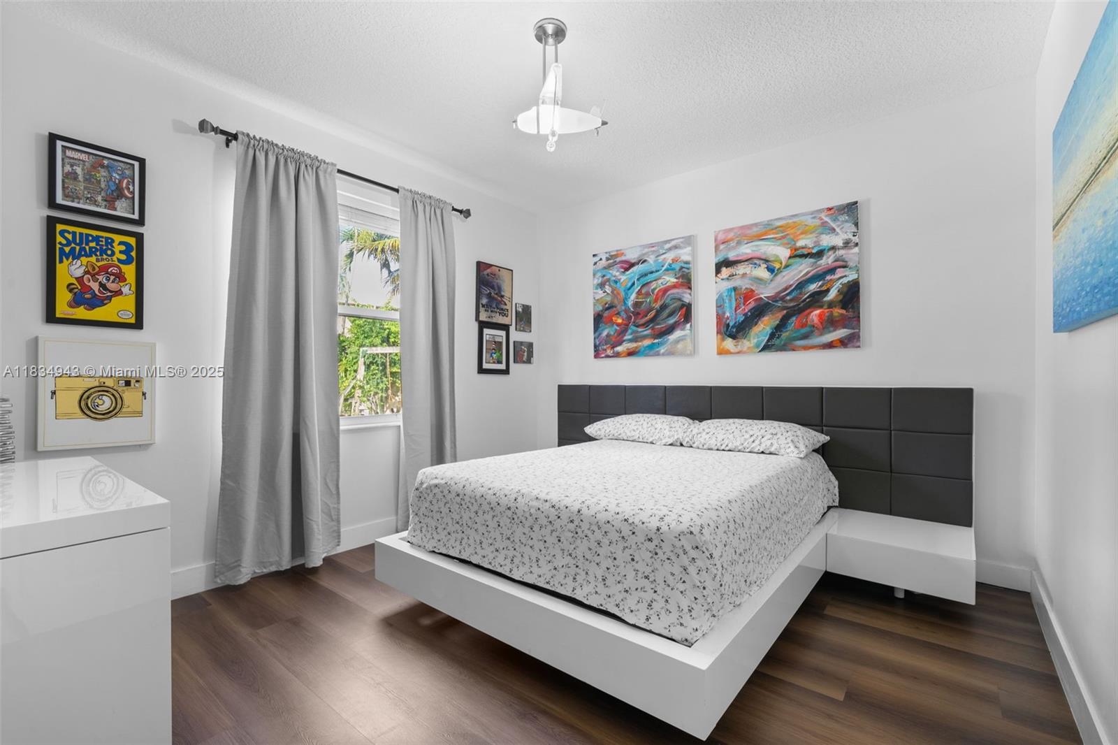 14501 Southwest 33rd Court Miramar, FL 33027 - Photo 20 of 91 a bedroom with a bed and a window