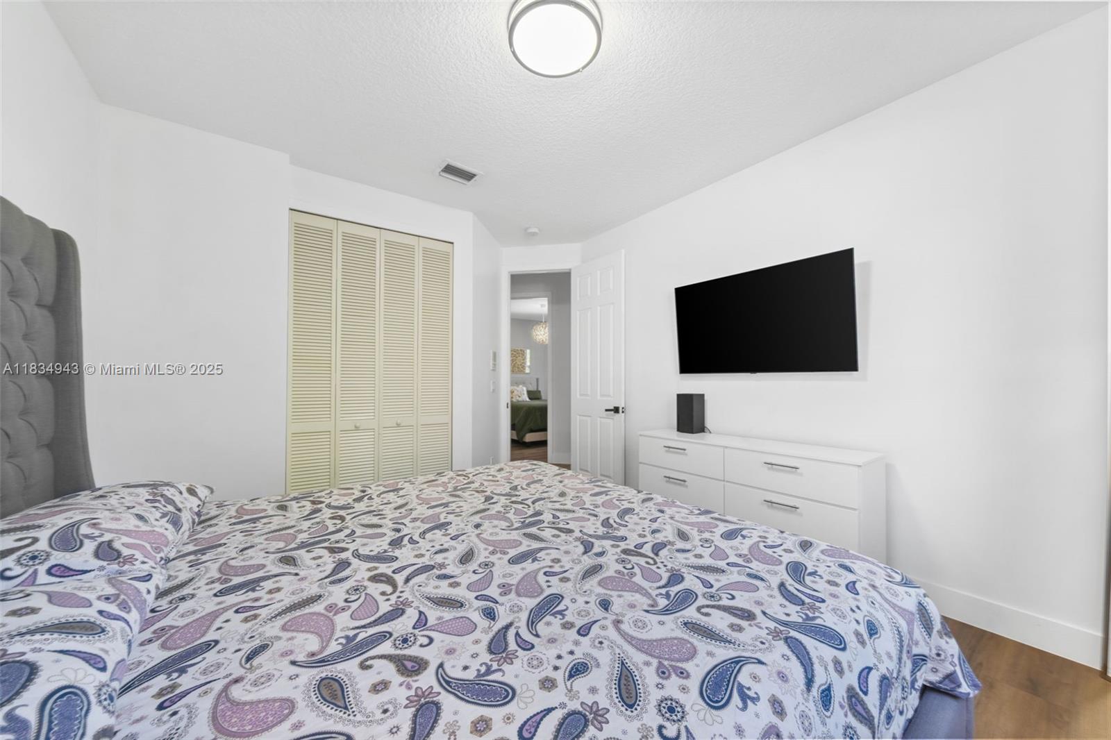 14501 Southwest 33rd Court Miramar, FL 33027 - Photo 23 of 91 a bedroom with a bed and a flat screen tv