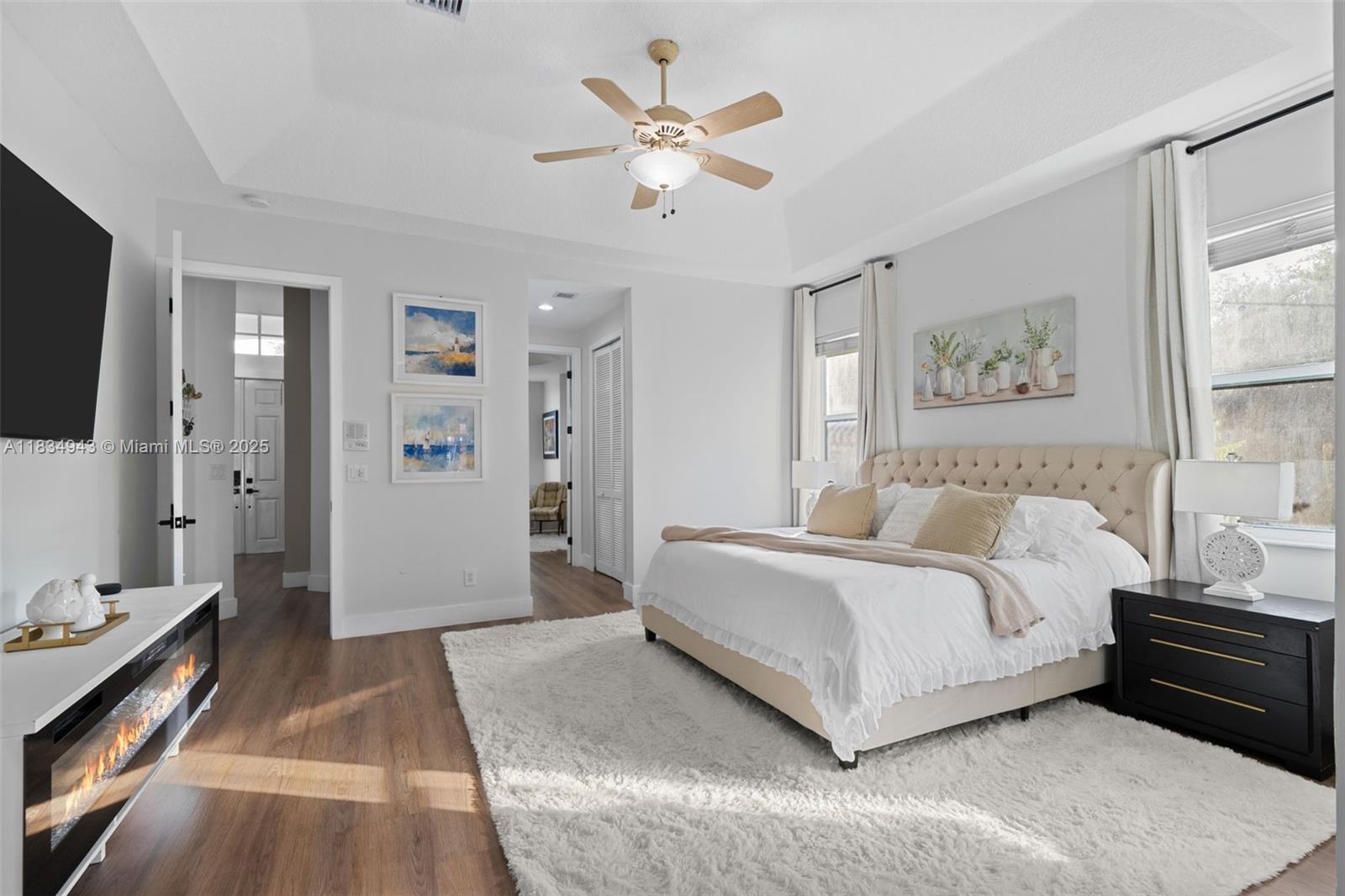 14501 Southwest 33rd Court Miramar, FL 33027 - Photo 31 of 91 a spacious bedroom with a large bed a flat screen tv and a couch