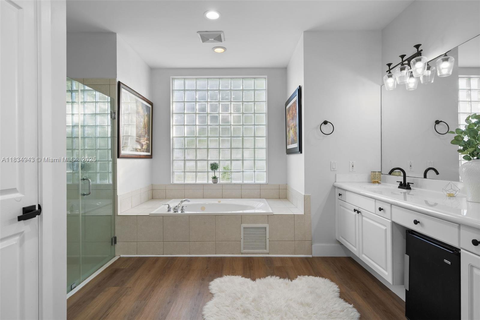 14501 Southwest 33rd Court Miramar, FL 33027 - Photo 35 of 91 a spacious bathroom with a tub sink and mirror