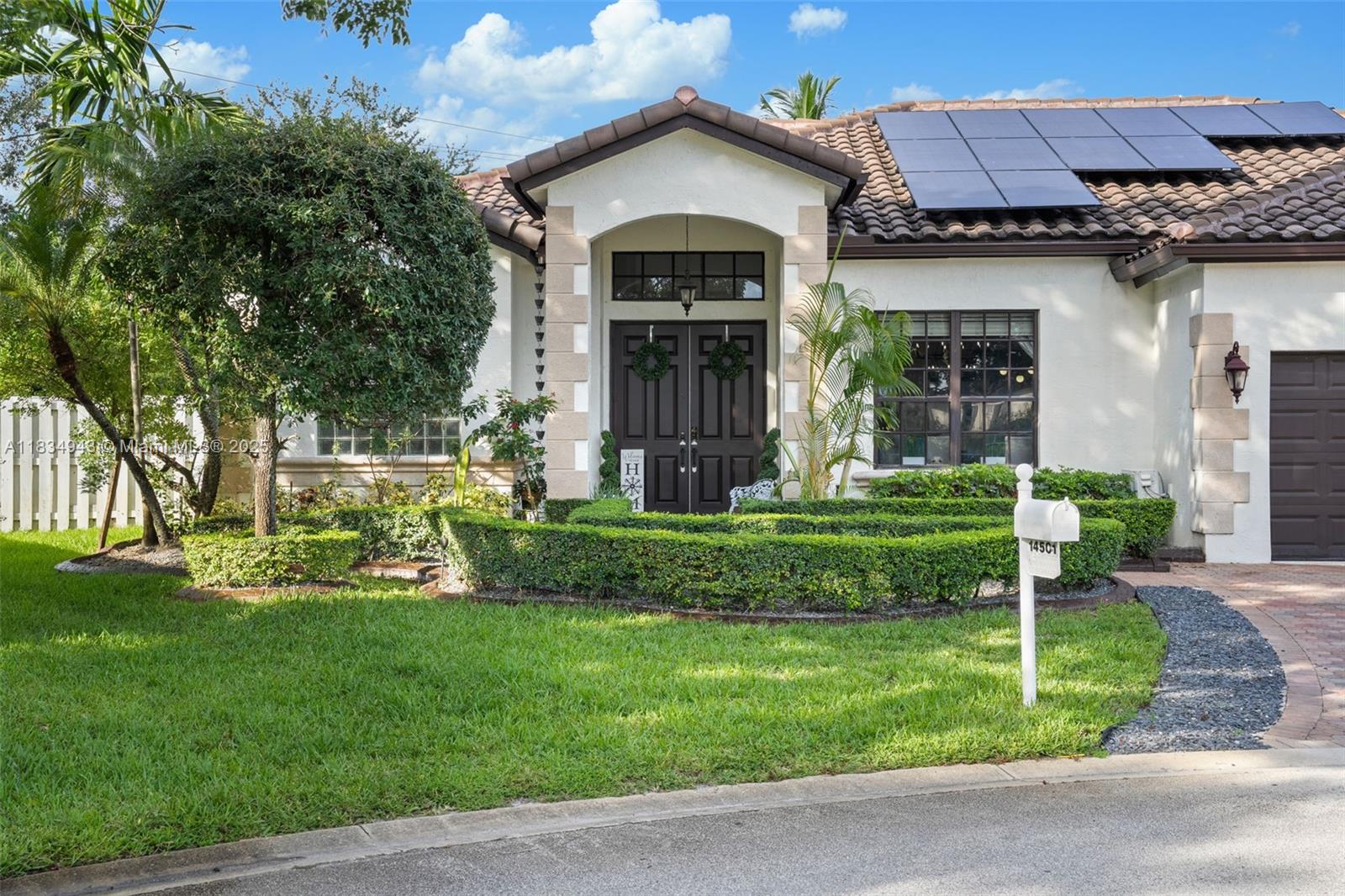 14501 Southwest 33rd Court Miramar, FL 33027 - Photo 38 of 91 a view of a house with garden and yard