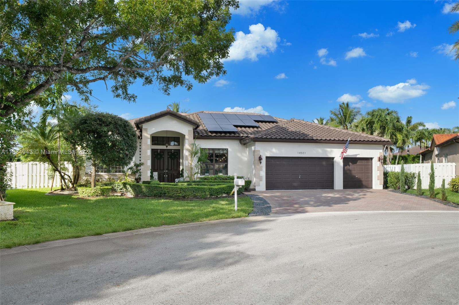 14501 Southwest 33rd Court Miramar, FL 33027 - Photo 39 of 91 a front view of a house with yard and green space