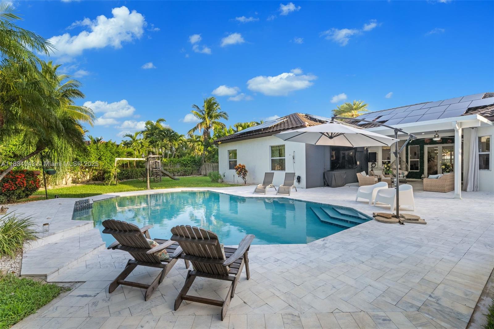 14501 Southwest 33rd Court Miramar, FL 33027 - Photo 43 of 91 a view of a house with swimming pool and sitting area